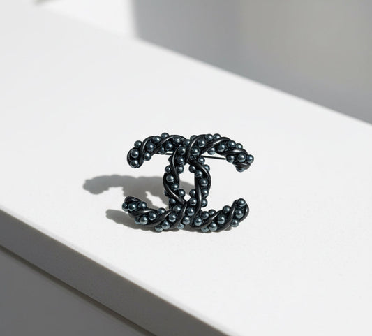 CHANEL Interlocking CC Brooch